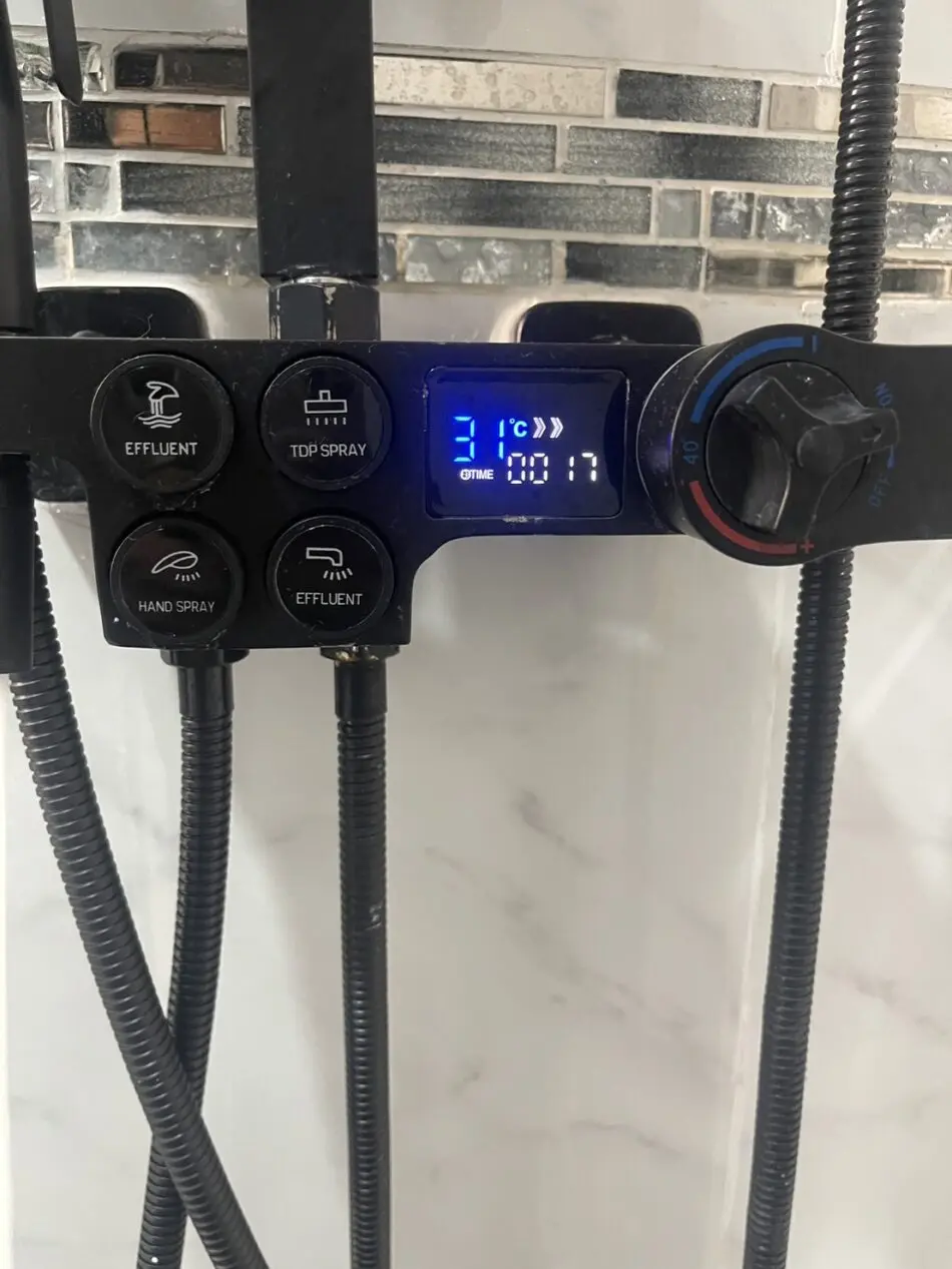 Digital rain shower in a bathroom at Thonglor Suites Hotel