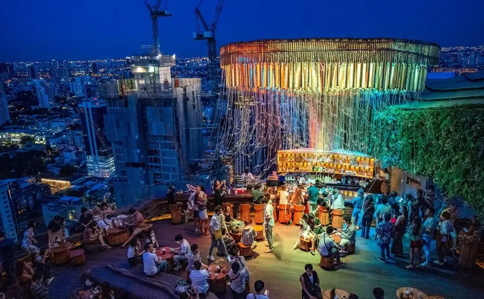 Tichuca Rooftop Bar illuminated at night in Thonglor